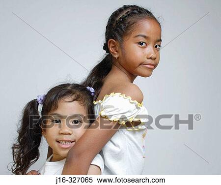 8 year old and 4 year old Asian Afro-American sisters View Large Photo Image Stock Photography - 8 year old and 4 year old Asian Afro-American sisters. Fotosearch