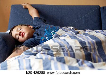Stock Photo - 8 year old boy sleeping. Fotosearch