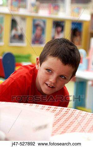 8 year old boy, smiling off camera View Large Photo Image Stock Image - 8 year old boy, smiling off camera. Fotosearch