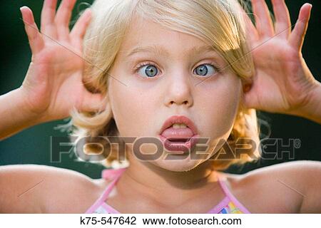8 year old Caucasian blonde girl playful View Large Photo Image Stock Image - 8 year old Caucasian blonde girl playful. Fotosearch