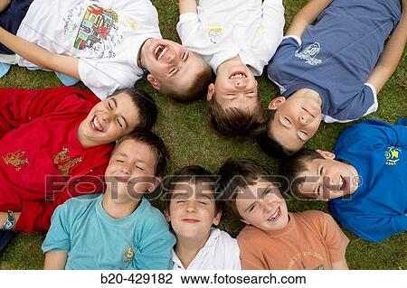Stock Image - 8 year old friends, birthday party. Fotosearch