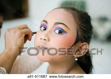 8 years old female dancer at her dance teacher home for make-up and practising Legong Kraton dance. Gyanar. Island of Bali. Indonesia View Large Photo Image Stock Photo - 8 years old female dancer at her dance teacher home for make-up and practising Legong Kraton dance. Gyanar. Island of Bali. Indonesia. Fotosearch