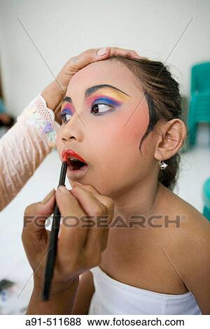 8 years old female dancer at her dance teacher home for make-up and practising Legong Kraton dance. Gyanar. Island of Bali. Indonesia View Large Photo Image Stock Photo - 8 years old female dancer at her dance teacher home for make-up and practising Legong Kraton dance. Gyanar. Island of Bali. Indonesia. Fotosearch