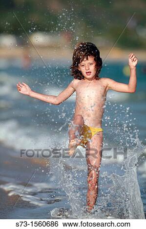 8 years old girl on the beach View Large Photo Image Stock Photograph - 8 years old girl on the beach. Fotosearch