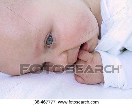 9 month old baby boy sucking his finger View Large Photo Image Stock Photo - 9 month old baby boy sucking his finger. Fotosearch