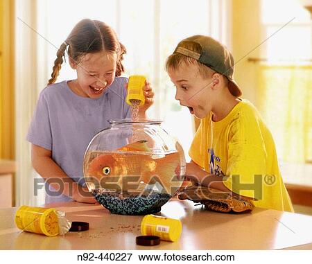 Stock Photo - 9 year old girl and 7 year old boy.. Fotosearch