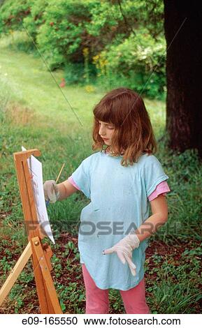 9-year-old girl painting at easel in clearing near woods, Brown County, Indiana View Large Photo Image Stock Image - 9-year-old girl painting at easel in clearing near woods, Brown County, Indiana. Fotosearch