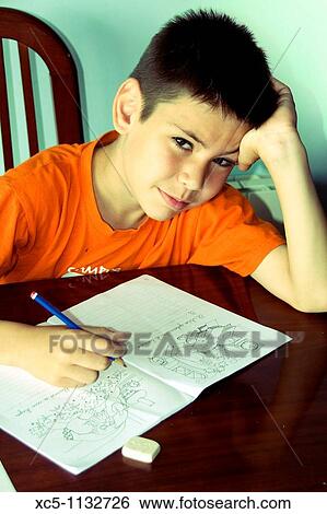 9 years old boy doing homework View Large Photo Image Stock Photograph - 9 years old boy doing homework. Fotosearch