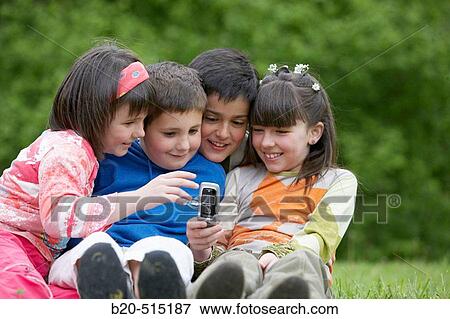 9 years old children, friends, mobile phone. View Large Photo Image Stock Photo - 9 years old children, friends, mobile phone.. Fotosearch