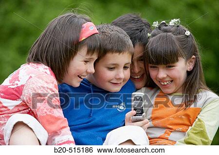 9 years old children, friends, mobile phone. View Large Photo Image Stock Photograph - 9 years old children, friends, mobile phone.. Fotosearch