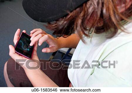 a 10 year old girl using an IPOD View Large Photo Image Stock Photograph - a 10 year old girl using an IPOD. Fotosearch