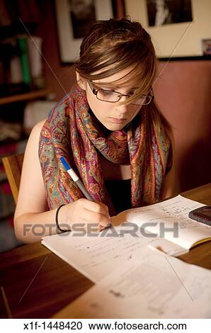 A 12 13 year old girl doing her mathematics homework at home UK View Large Photo Image Stock Image - A 12 13 year old girl doing her mathematics homework at home UK. Fotosearch