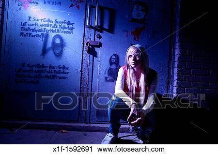A 16 year old blonde haired slim teenage girl, alone in a dingy urban location, UK View Large Photo Image Stock Image - A 16 year old blonde haired slim teenage girl, alone in a dingy urban location, UK. Fotosearch