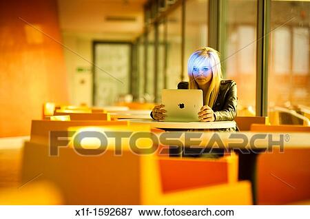 A 16 year old blonde haired slim teenage girl, using an Apple iPad, UK View Large Photo Image Stock Photo - A 16 year old blonde haired slim teenage girl, using an Apple iPad, UK. Fotosearch