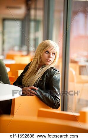 A 16 year old blonde haired slim teenage girl, sitting waiting looking out of a window, UK View Large Photo Image Stock Photograph - A 16 year old blonde haired slim teenage girl, sitting waiting looking out of a window, UK. Fotosearch