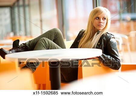 A 16 year old blonde haired slim teenage girl, sitting waiting looking out of a window, UK View Large Photo Image Stock Photography - A 16 year old blonde haired slim teenage girl, sitting waiting looking out of a window, UK. Fotosearch
