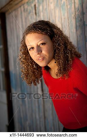 a 20 year old woman wearing red jumper View Large Photo Image Stock Image - a 20 year old woman wearing red jumper. Fotosearch