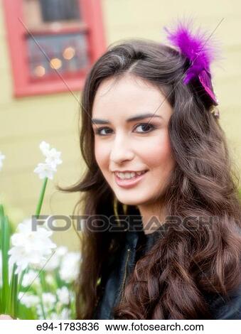 A 21 year old brunette woman at a plant nursery View Large Photo Image Stock Photograph - A 21 year old brunette woman at a plant nursery. Fotosearch