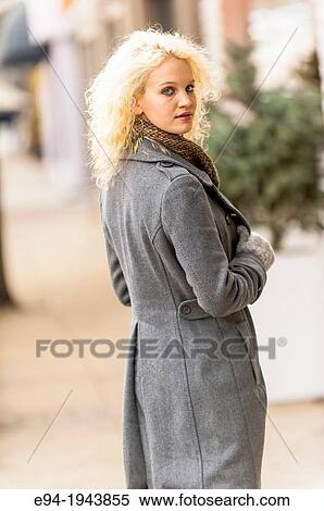 A 22 year old blond woman wearing winter clothes in a city environment. View Large Photo Image Stock Photography - A 22 year old blond woman wearing winter clothes in a city environment.. Fotosearch