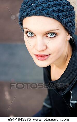 A 22 year old blond woman wearing jogging clothes smiling at the camera. View Large Photo Image Stock Photography - A 22 year old blond woman wearing jogging clothes smiling at the camera.. Fotosearch
