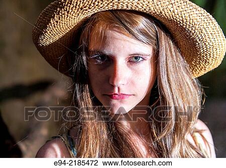 A 22 year old brunette woman in a bamboo forest wearing a summer dress and a straw hat looking directly at the camera. View Large Photo Image Stock Image - A 22 year old brunette woman in a bamboo forest wearing a summer dress and a straw hat looking directly at the camera.. Fotosearch