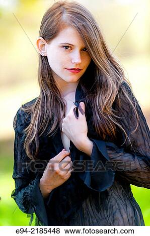A 22 year old brunette woman looking directly at the camera, outdoors. View Large Photo Image Stock Photo - A 22 year old brunette woman looking directly at the camera, outdoors.. Fotosearch