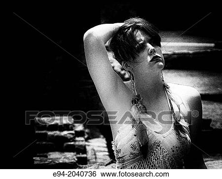A 22 year old brunette woman looking away from the camera, outside black and white. View Large Photo Image Stock Photograph - A 22 year old brunette woman looking away from the camera, outside black and white.. Fotosearch