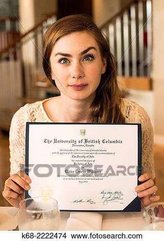 A 22 year old woman in a portrait on her university graduation day. View Large Photo Image Picture - A 22 year old woman in a portrait on her university graduation day.. Fotosearch
