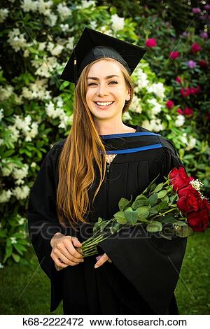 A 22 year old woman in a portrait on her university graduation day. View Large Photo Image Stock Image - A 22 year old woman in a portrait on her university graduation day.. Fotosearch