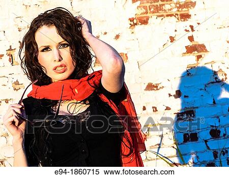 A 24 year old brunette woman in a run-down urban setting View Large Photo Image Stock Photography - A 24 year old brunette woman in a run-down urban setting. Fotosearch