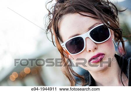 A 24 year old brunette woman in with white rimmed sunglasses. View Large Photo Image Stock Image - A 24 year old brunette woman in with white rimmed sunglasses.. Fotosearch