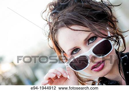A 24 year old brunette woman in with white rimmed sunglasses. View Large Photo Image Stock Image - A 24 year old brunette woman in with white rimmed sunglasses.. Fotosearch
