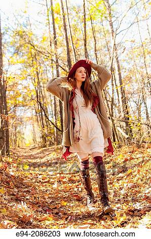 A 25 year old red headed woman in a forest setting in the autumn. View Large Photo Image Stock Image - A 25 year old red headed woman in a forest setting in the autumn.. Fotosearch