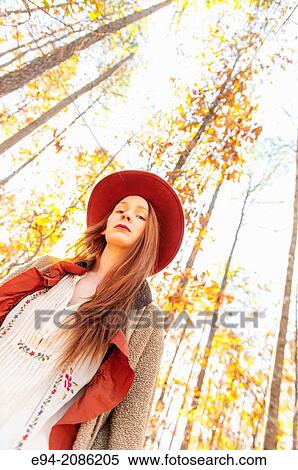 A 25 year old red headed woman in a forest setting in the autumn. View Large Photo Image Stock Photography - A 25 year old red headed woman in a forest setting in the autumn.. Fotosearch