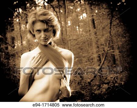 A 29 year old blond woman in a forest wrapped in a purple cloth View Large Photo Image Stock Photography - A 29 year old blond woman in a forest wrapped in a purple cloth. Fotosearch