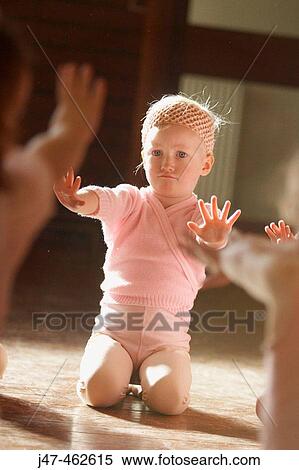 A 3 year old girl in a ballet class, dressed in pink leotards and tights, stretching her arms out to say no View Large Photo Image Stock Photography - A 3 year old girl in a ballet class, dressed in pink leotards and tights, stretching her arms out to say no. Fotosearch