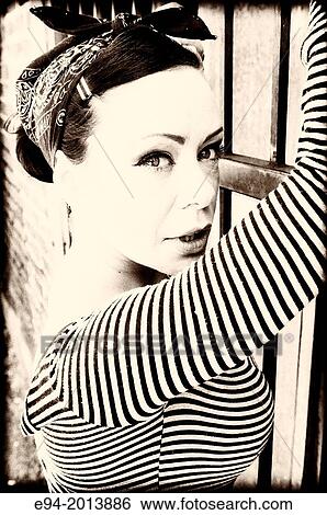 A 35 year old brunette woman looking directly at the camera wearing a stripped shirt, black & white. View Large Photo Image Stock Photograph - A 35 year old brunette woman looking directly at the camera wearing a stripped shirt, black & white.. Fotosearch