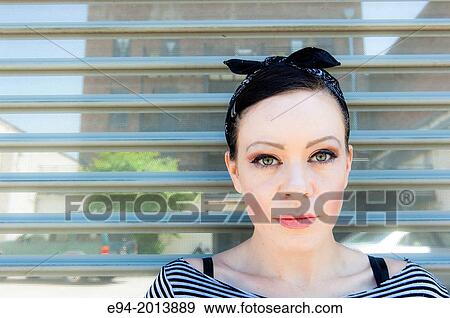 A 35 year old brunette woman posing in an urban environment. View Large Photo Image Stock Photo - A 35 year old brunette woman posing in an urban environment.. Fotosearch