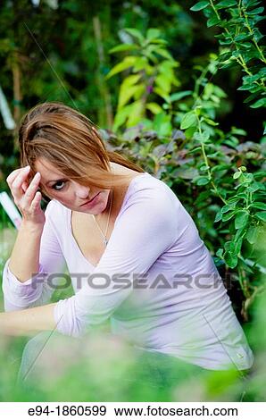A 38 year old redheaded woman in a garden setting View Large Photo Image Stock Photo - A 38 year old redheaded woman in a garden setting. Fotosearch