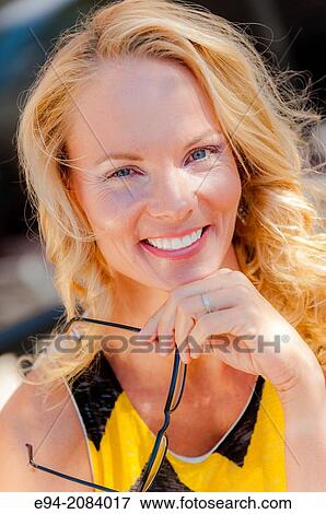 Stock Photo - A 39 year old blond woman smiling at the camera.. Fotosearch