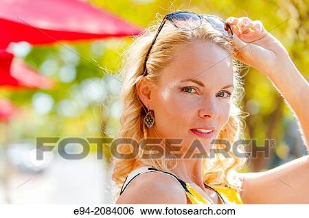 A 39 year old blond woman with a serious expression. View Large Photo Image Stock Photograph - A 39 year old blond woman with a serious expression.. Fotosearch