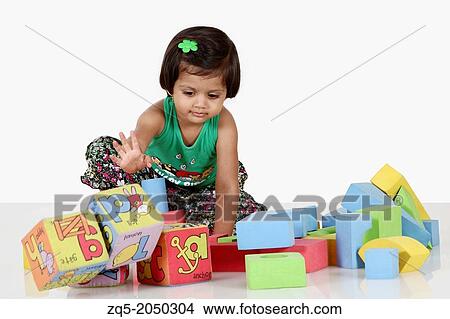 A 6 year old girl playing with the toys. Pune India View Large Photo Image Picture - A 6 year old girl playing with the toys. Pune India. Fotosearch