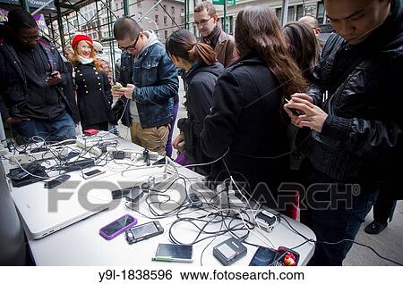 A 7-Eleven store set up charging stations outside it's store for people to charge their cell phones in midtown in New York View Large Photo Image Stock Photograph - A 7-Eleven store set up charging stations outside it's store for people to charge their cell phones in midtown in New York. Fotosearch