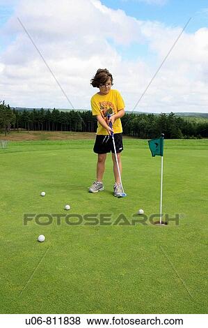 a 7 year old girl golfing at putting green View Large Photo Image Stock Photo - a 7 year old girl golfing at putting green. Fotosearch