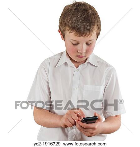 A 9 year old boy dialing or texting on a smartphone View Large Photo Image Stock Photo - A 9 year old boy dialing or texting on a smartphone. Fotosearch