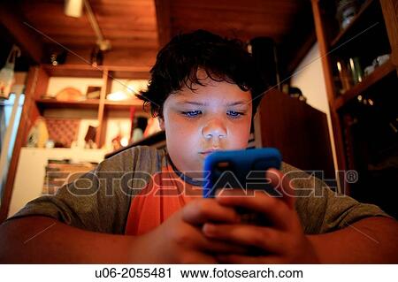 A 9 year old boy playing games on an apple ipod touch electronic device View Large Photo Image Stock Image - A 9 year old boy playing games on an apple ipod touch electronic device. Fotosearch