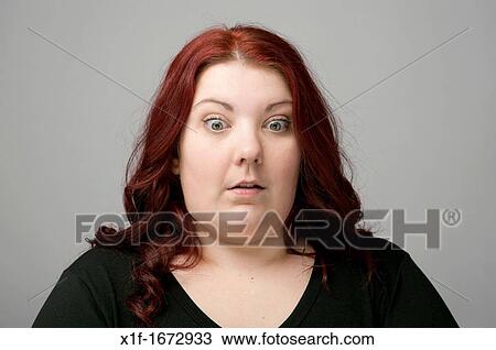 A auburn haired caucasian woman looking worried shocked concerned View Large Photo Image Stock Image - A auburn haired caucasian woman looking worried shocked concerned. Fotosearch