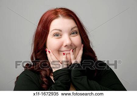 A auburn haired caucasian woman looking happy smiling View Large Photo Image Stock Photography - A auburn haired caucasian woman looking happy smiling. Fotosearch