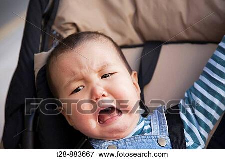 A baby crying View Large Photo Image Stock Photo - A baby crying. Fotosearch