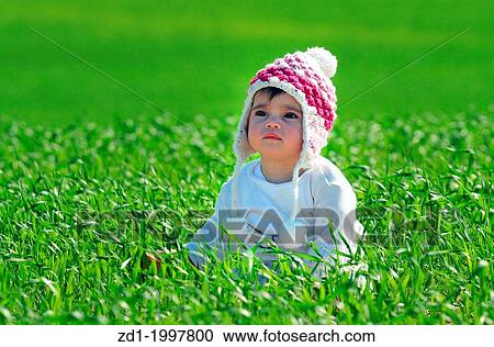 A baby enjoy the warm sunshine and the green landscape. View Large Photo Image Stock Image - A baby enjoy the warm sunshine and the green landscape.. Fotosearch
